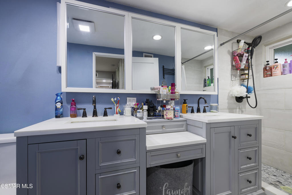 1231 Bluebell Street Oxnard, CA 93036 - Photo 21 of 44 a view of cabinets a sink a washer and dryer