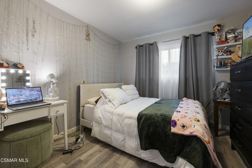 1231 Bluebell Street Oxnard, CA 93036 - Photo 23 of 44 a bedroom with a bed and a dresser