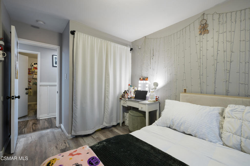 1231 Bluebell Street Oxnard, CA 93036 - Photo 24 of 44 a bedroom with a bed and a table in it