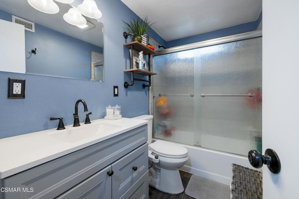1231 Bluebell Street Oxnard, CA 93036 - Photo 26 of 44 a bathroom with a sink and a mirror