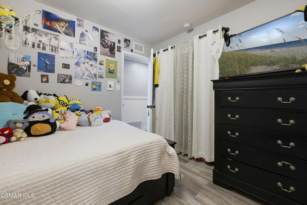 1231 Bluebell Street Oxnard, CA 93036 - Photo 30 of 44 a bedroom with a bed and a dresser