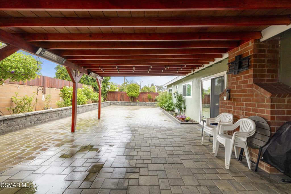 1231 Bluebell Street Oxnard, CA 93036 - Photo 32 of 44 a view of a patio with table and chairs and wooden floor