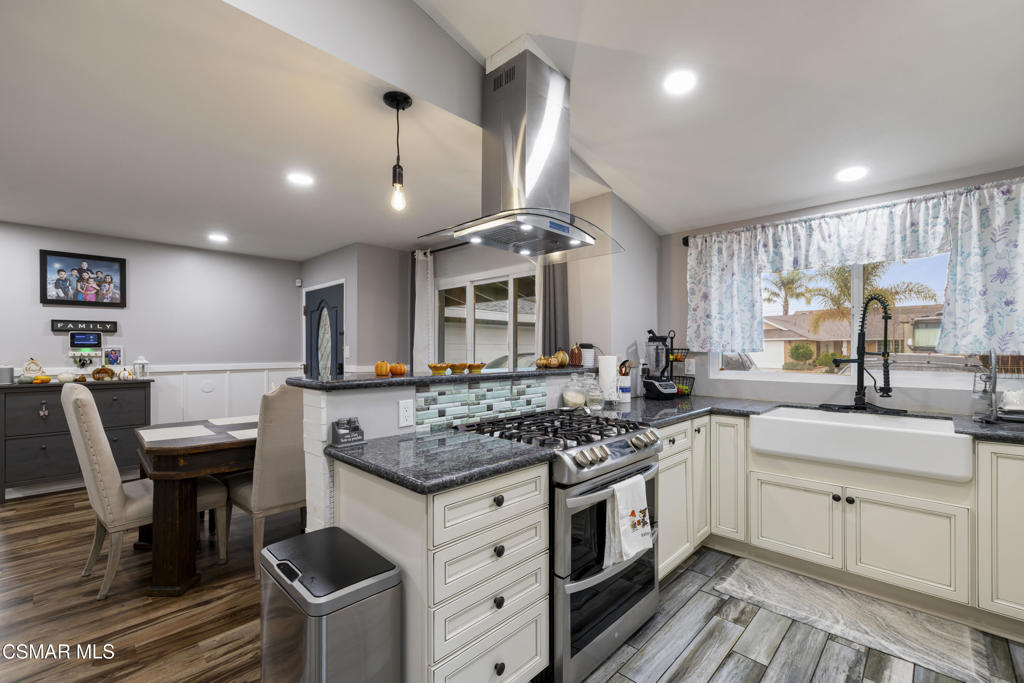 1231 Bluebell Street Oxnard, CA 93036 - Photo 10 of 44 a kitchen with stainless steel appliances granite countertop a stove and a sink