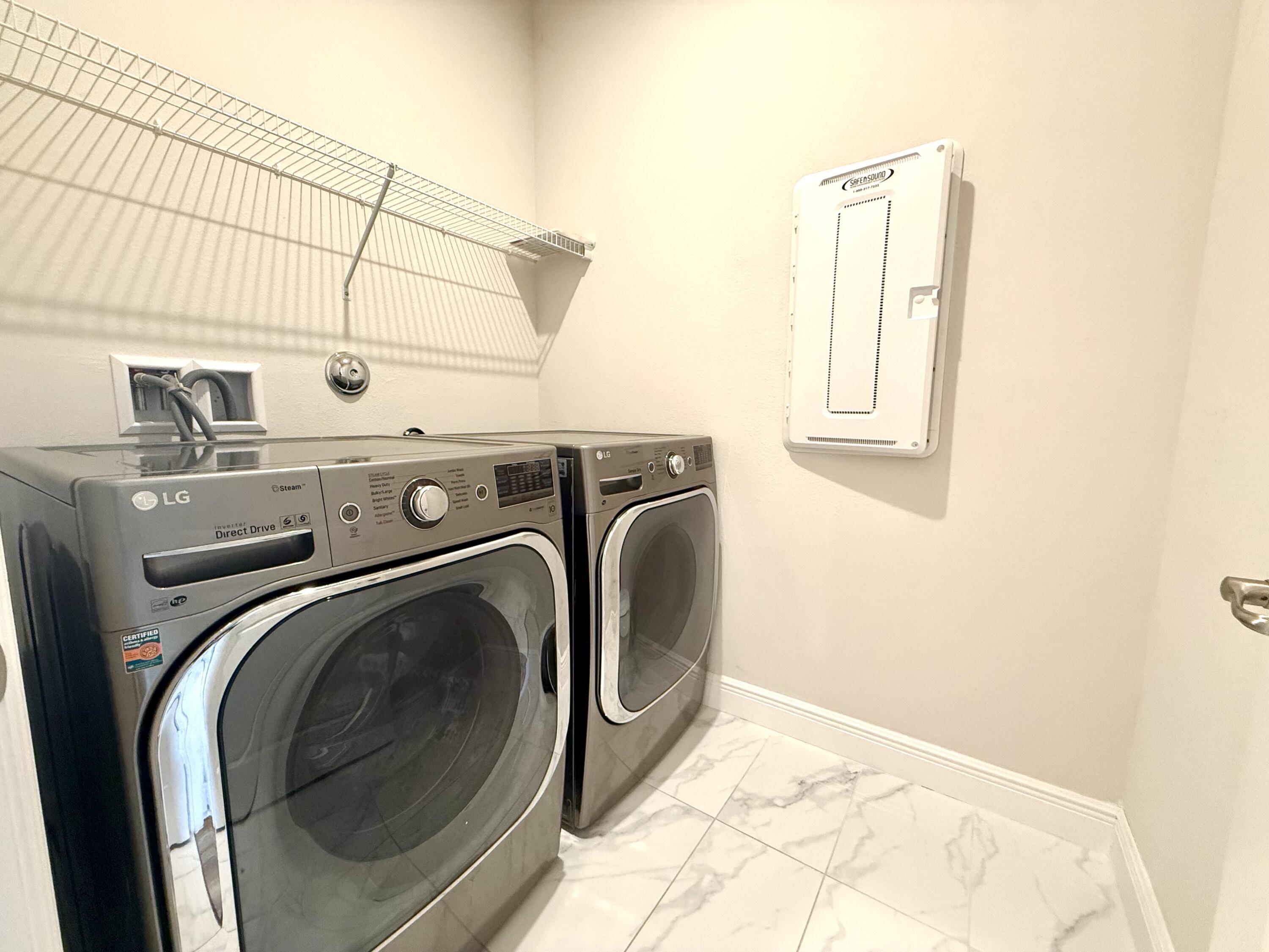 10819 Southwest Pacini Way Port St. Lucie, FL 34987 - Photo 16 of 43 a utility room with dryer and washer