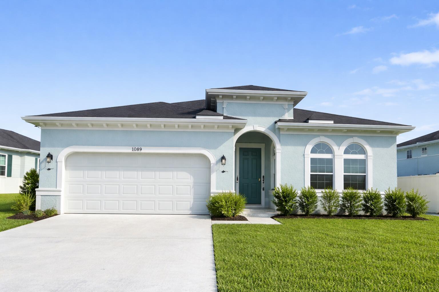 10819 Southwest Pacini Way Port St. Lucie, FL 34987 - Photo 43 of 43 a front view of a house with garden