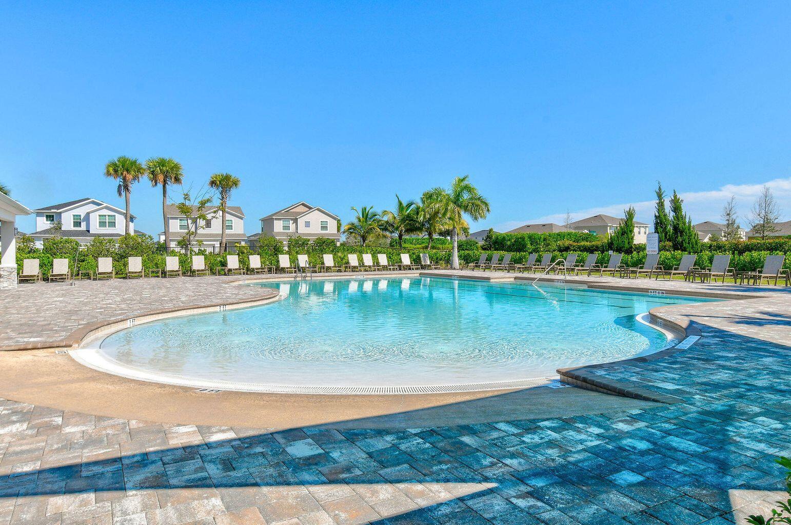 10819 Southwest Pacini Way Port St. Lucie, FL 34987 - Photo 6 of 43 swimming pool view with a lake view