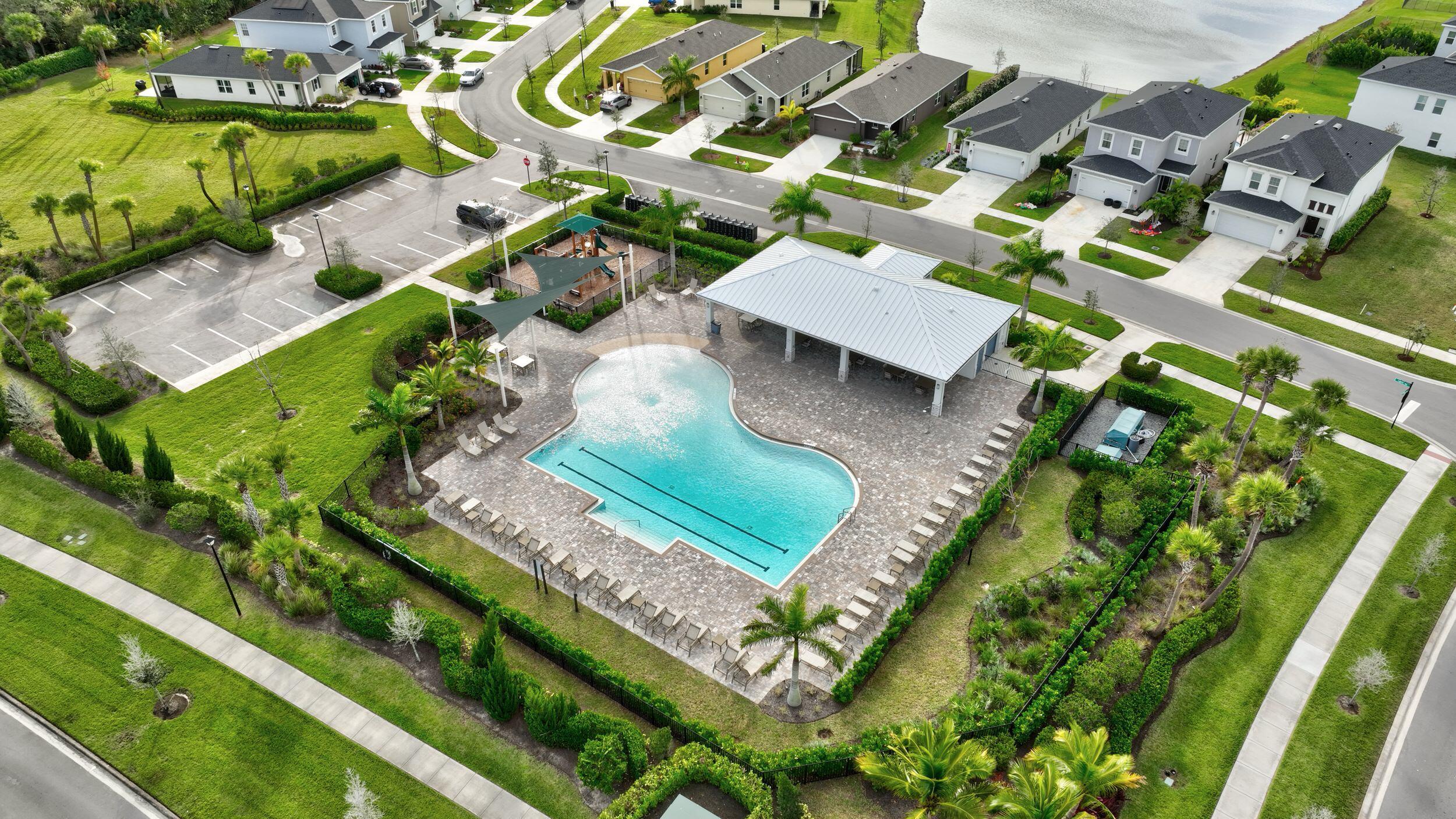 10819 Southwest Pacini Way Port St. Lucie, FL 34987 - Photo 8 of 43 an aerial view of a house with a garden and swimming pool