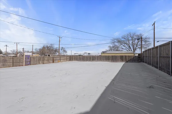 a view of a house with a snow on the road