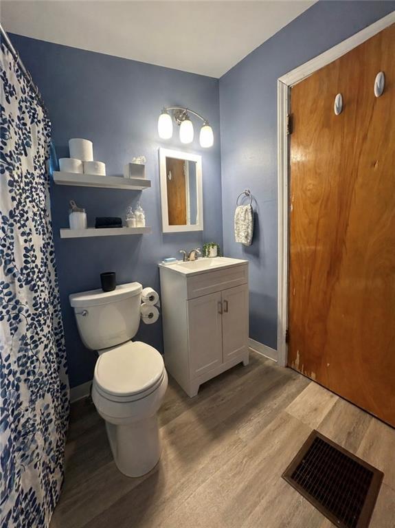 1133 Venetia Road Eighty Four, PA 15330 - Photo 11 of 26 a bathroom with a toilet a sink and mirror