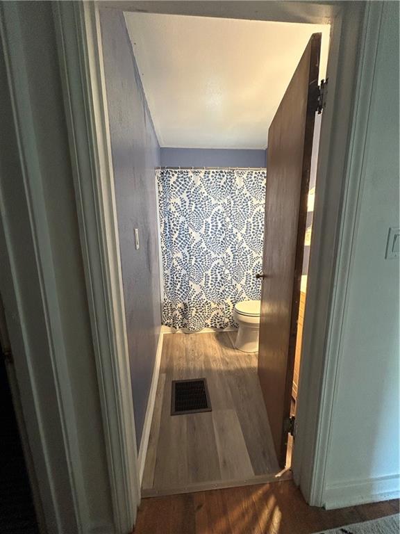 1133 Venetia Road Eighty Four, PA 15330 - Photo 12 of 26 a view of an empty room with wooden floor and door