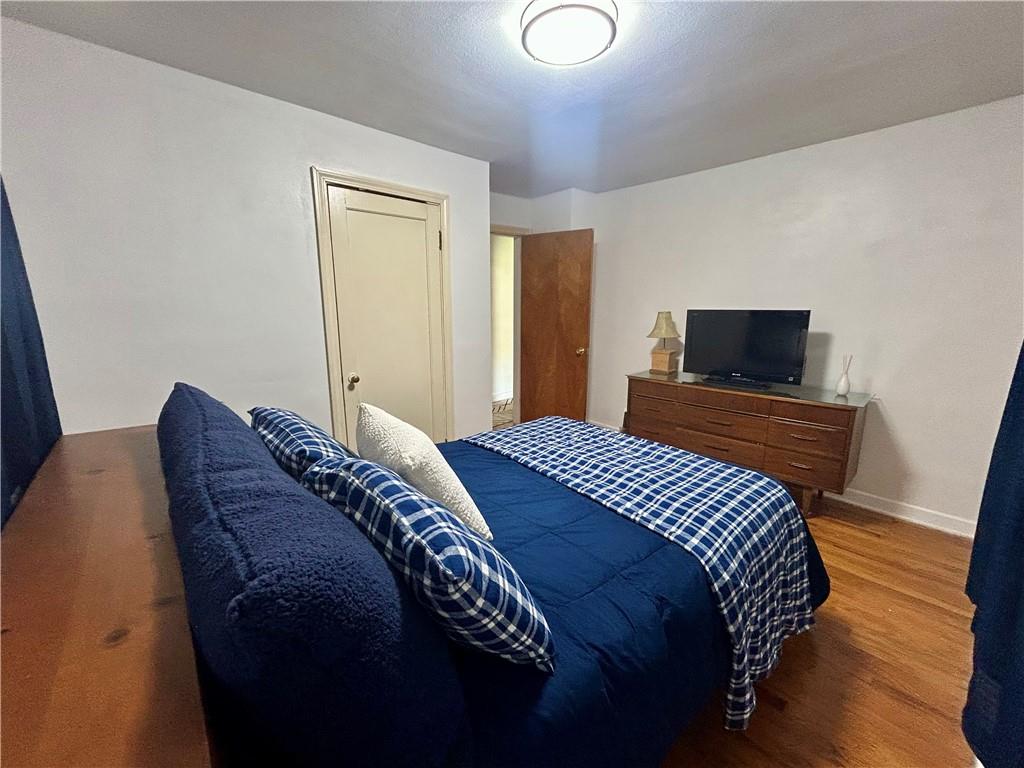 1133 Venetia Road Eighty Four, PA 15330 - Photo 18 of 26 a bedroom with a bed and a flat screen tv