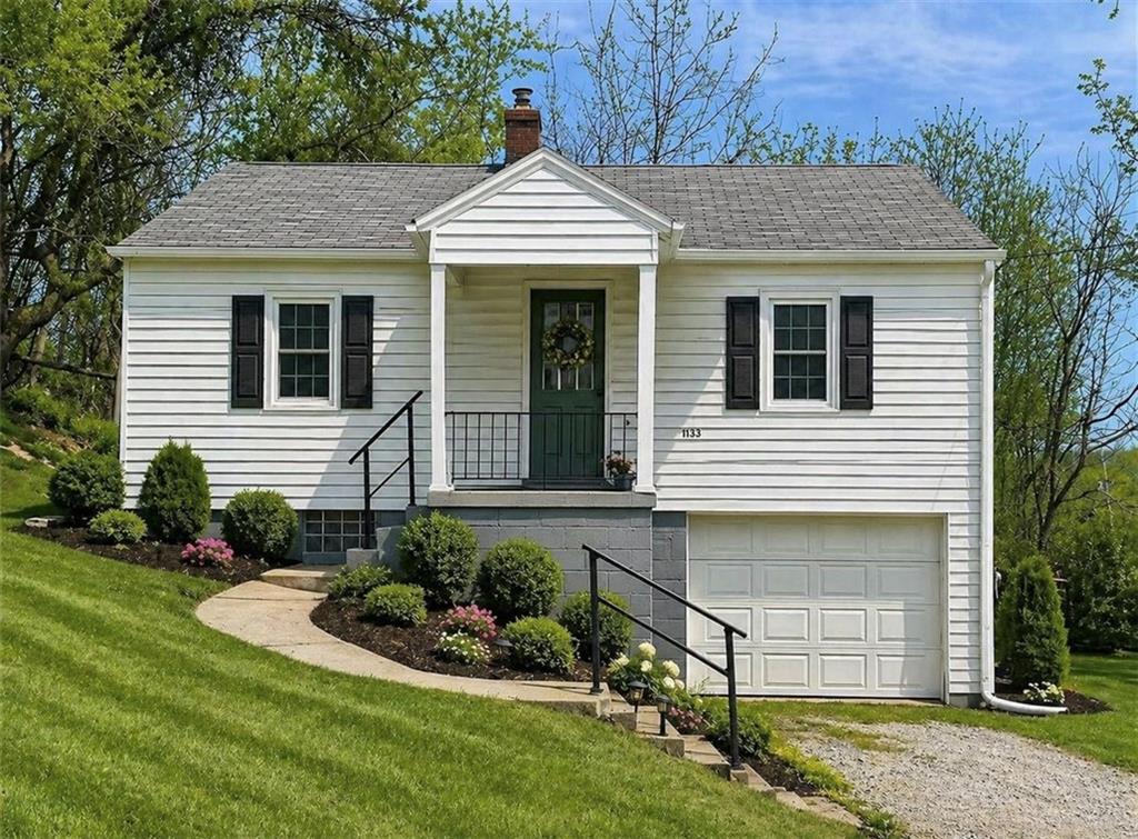 1133 Venetia Road Eighty Four, PA 15330 - Photo 2 of 26 a front view of a house with a yard and garage