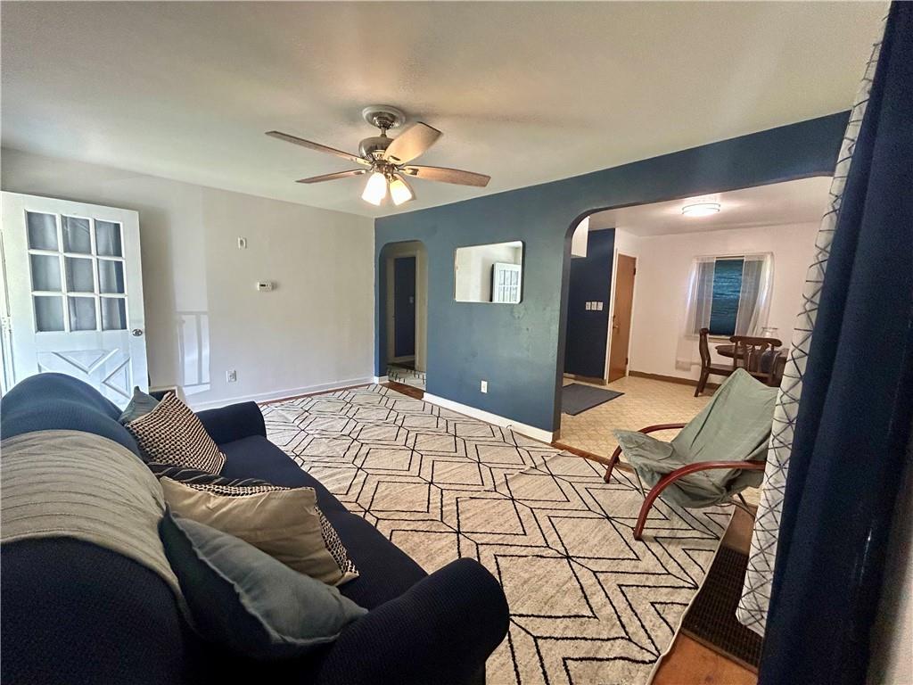 1133 Venetia Road Eighty Four, PA 15330 - Photo 4 of 26 a bedroom with a bed ceiling fan and a wooden floor