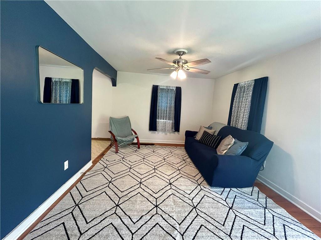 1133 Venetia Road Eighty Four, PA 15330 - Photo 5 of 26 a bedroom with a bed lamp and wooden floor