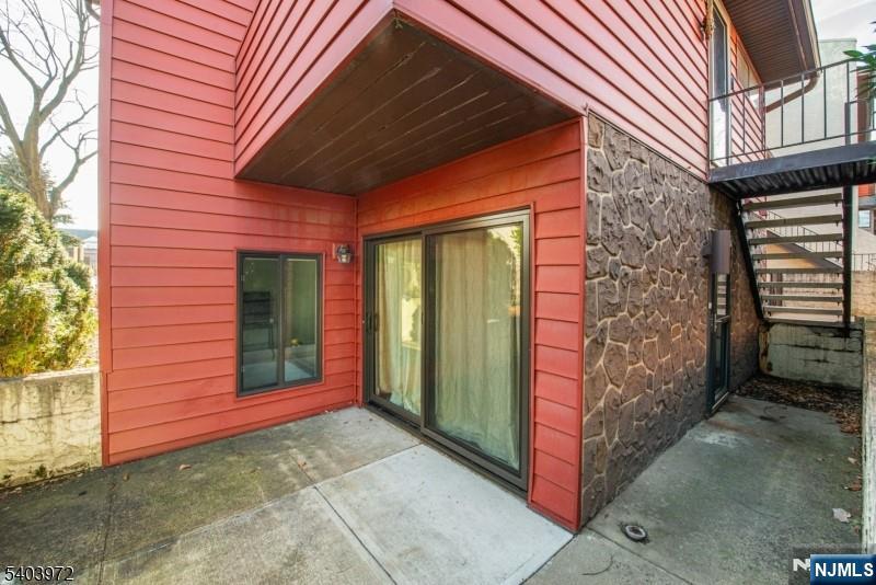 105 River Road, Unit C1 Nutley, NJ 07110 - Photo 20 of 22 a view of front door of a house with a yard