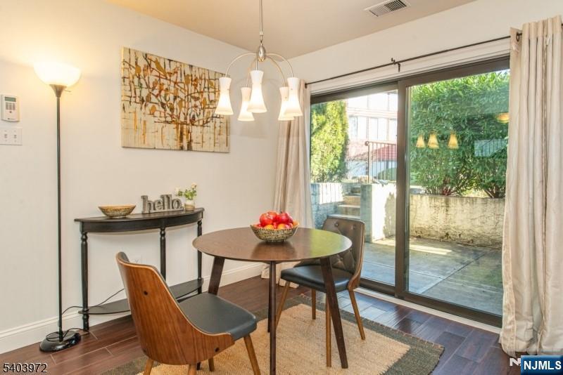 105 River Road, Unit C1 Nutley, NJ 07110 - Photo 7 of 22 a view of a dining room with furniture window and outside view
