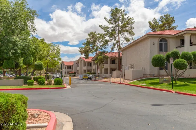 a view of a house with a yard and plants