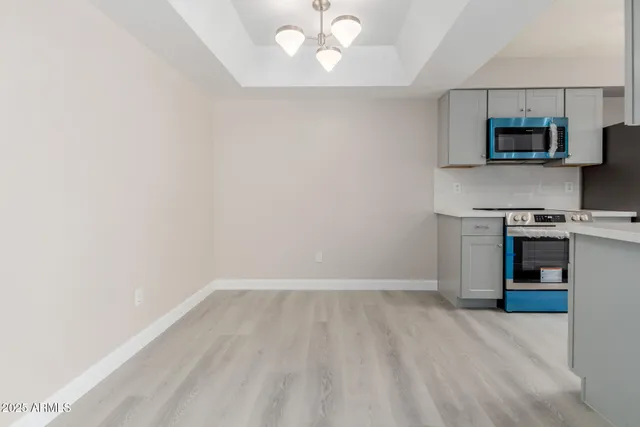 a view of a kitchen with microwave and stove