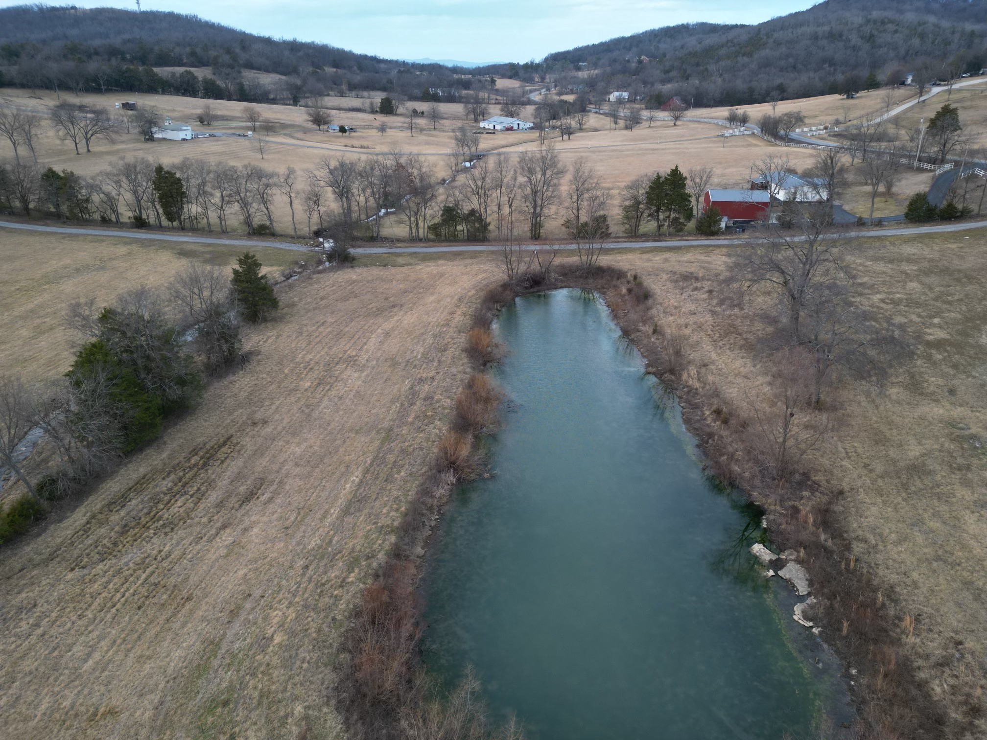521 Coop Road Bell Buckle, TN 37020 - Photo 25 of 63 a view of a lake with outdoor space
