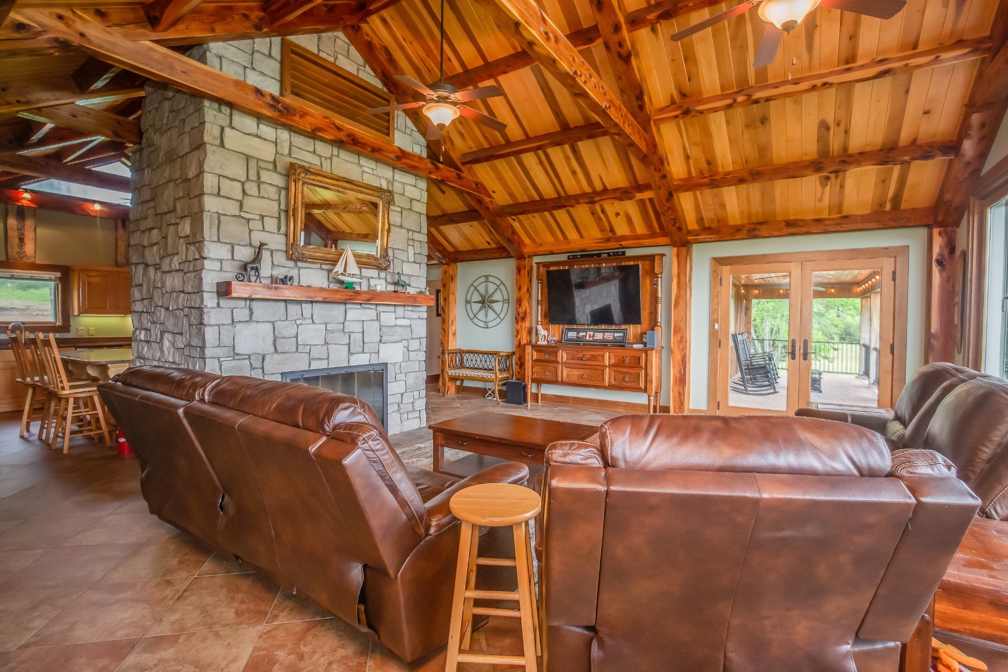 521 Coop Road Bell Buckle, TN 37020 - Photo 34 of 63 a living room with furniture a fireplace and blue walls