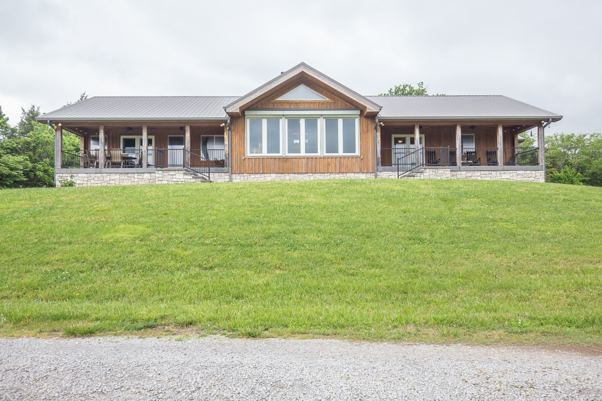 521 Coop Road Bell Buckle, TN 37020 - Photo 4 of 63 a front view of a house with a garden
