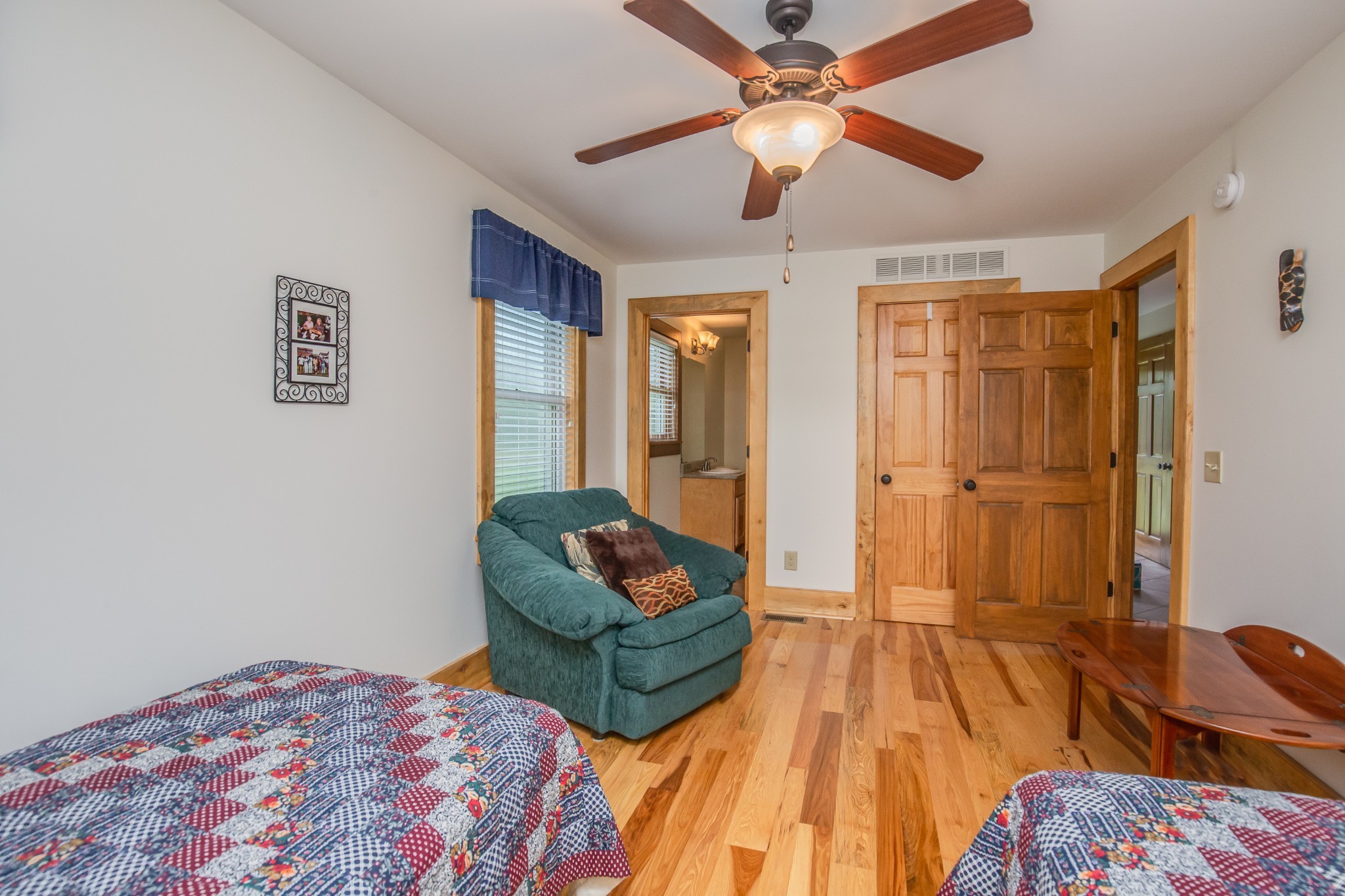 521 Coop Road Bell Buckle, TN 37020 - Photo 42 of 63 a bedroom with a bed couch and a window
