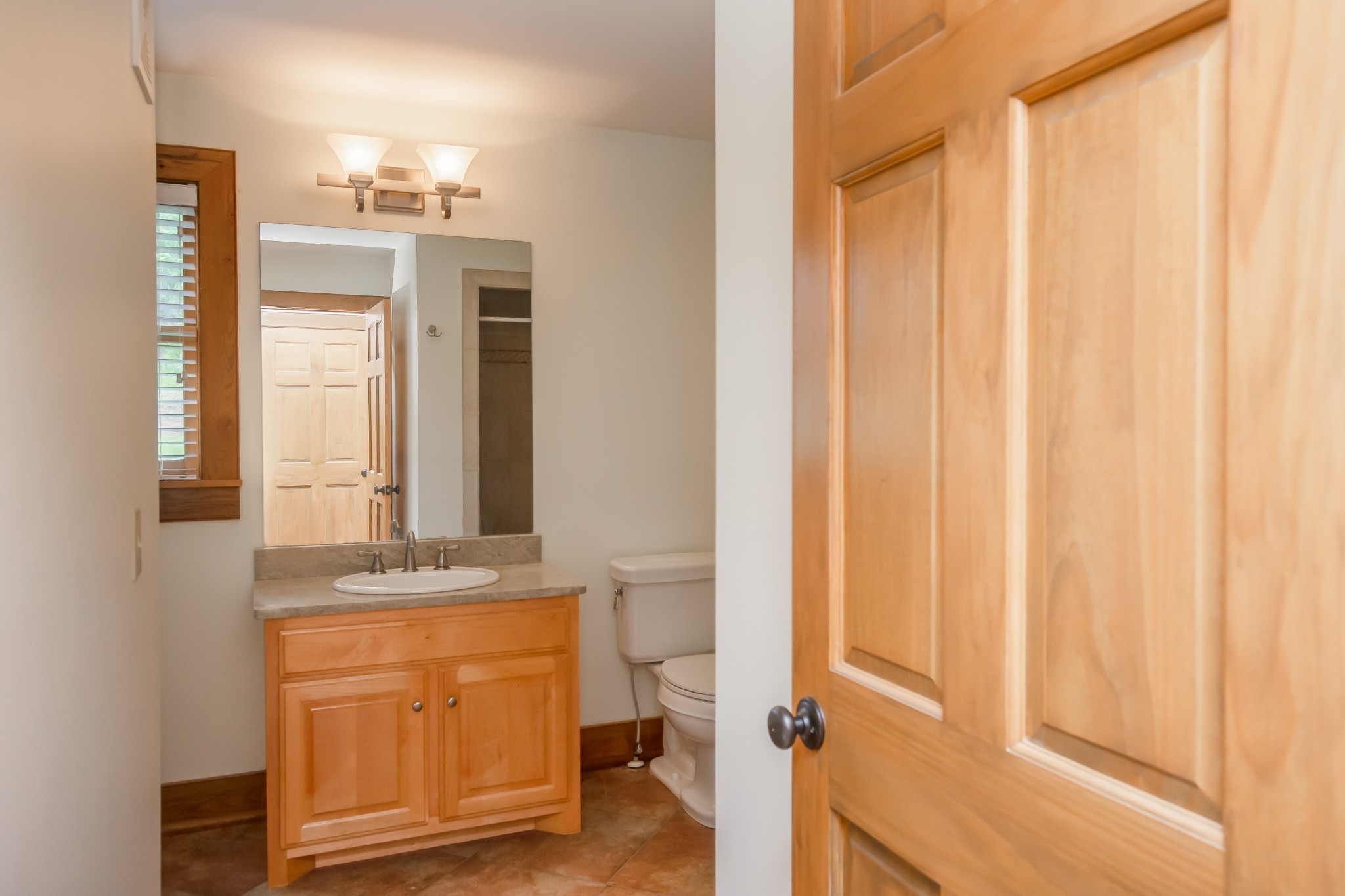 521 Coop Road Bell Buckle, TN 37020 - Photo 45 of 63 a bathroom with a granite countertop sink and a mirror