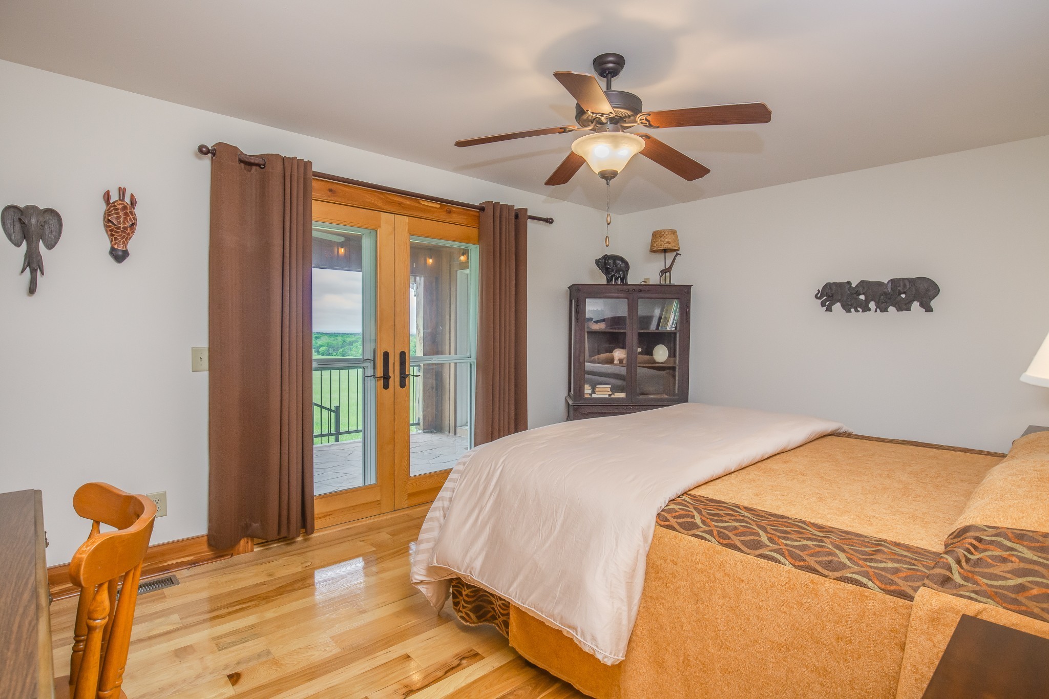 521 Coop Road Bell Buckle, TN 37020 - Photo 46 of 63 a bedroom with a bed and a chandelier