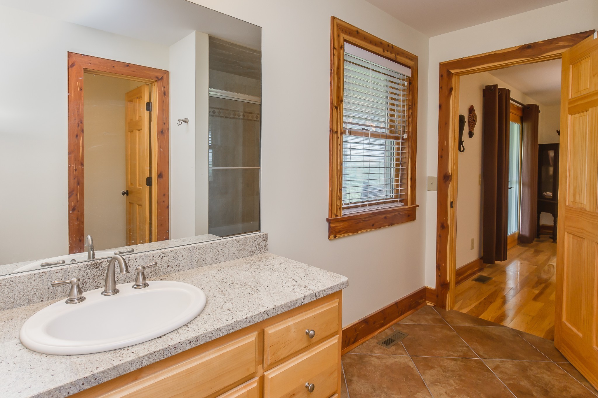521 Coop Road Bell Buckle, TN 37020 - Photo 49 of 63 a bathroom with a granite countertop sink and a mirror