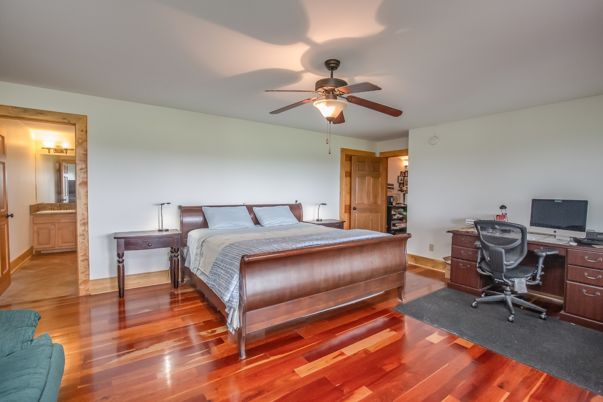 521 Coop Road Bell Buckle, TN 37020 - Photo 50 of 63 a bedroom with a bed and a chandelier