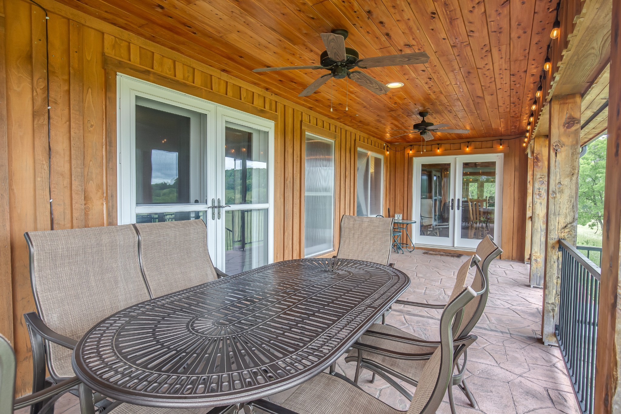 521 Coop Road Bell Buckle, TN 37020 - Photo 59 of 63 a view of a patio with a table and chairs