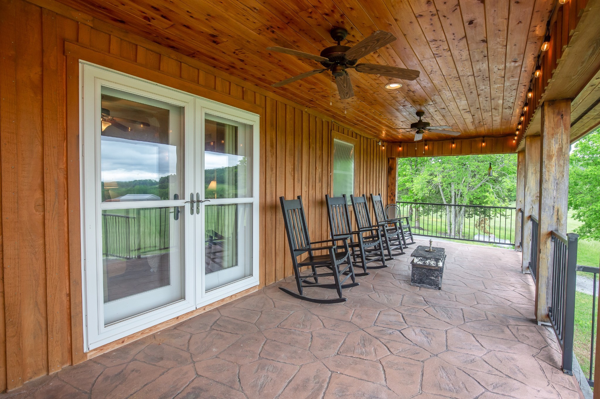 521 Coop Road Bell Buckle, TN 37020 - Photo 62 of 63 a view of porch with a table and chairs