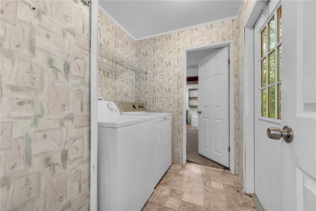 383 Rocky Knoll Road Walhalla, SC 29691 - Photo 28 of 50 Functional laundry area features convenient overhead shelving and durable tile flooring.
