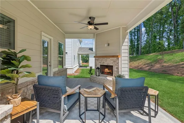 a view of a patio with a table chairs and a backyard