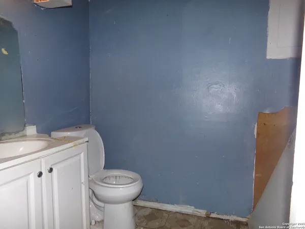 a bathroom with a toilet and a sink