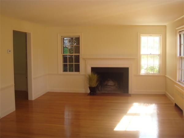 103-105 Channing Road, Unit 103 Watertown, MA 02472 - Photo 3 of 11 a view of empty room with a fireplace