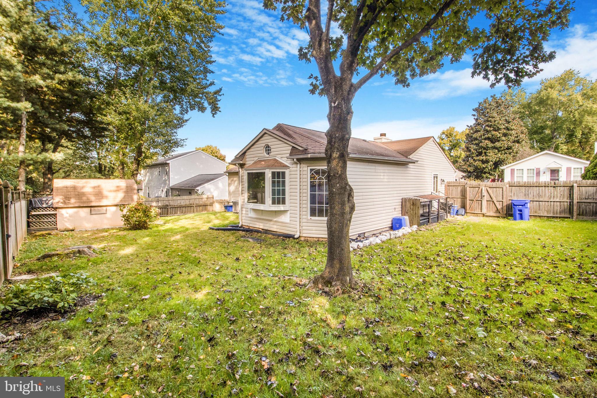 7316 Torran Rocks Way Gaithersburg, MD 20879 - Photo 8 of 17 a front view of a house with a yard table and chairs