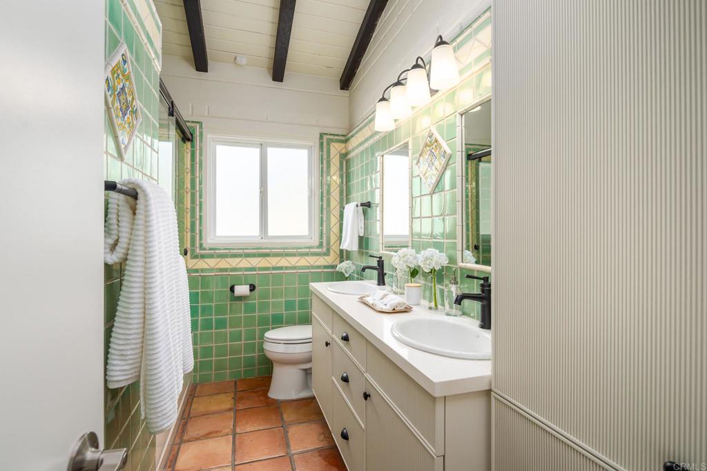 1935 Santa Fe Avenue Del Mar, CA 92014 - Photo 12 of 42 a bathroom with a sink toilet and mirror
