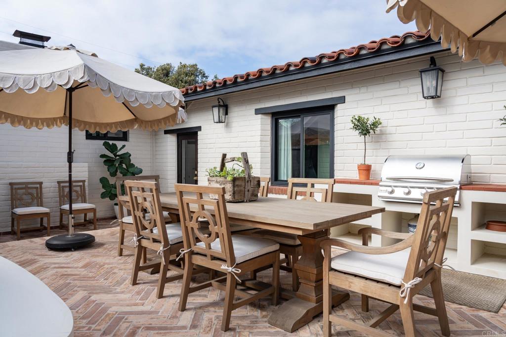 1935 Santa Fe Avenue Del Mar, CA 92014 - Photo 20 of 42 a view of a patio with table and chairs and potted plants