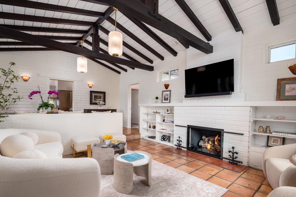 1935 Santa Fe Avenue Del Mar, CA 92014 - Photo 4 of 42 a living room with furniture a flat screen tv and a fireplace