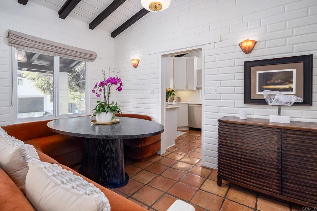 1935 Santa Fe Avenue Del Mar, CA 92014 - Photo 7 of 42 a dining hall with granite countertop a sink dishwasher a dining table and chairs with wooden floor