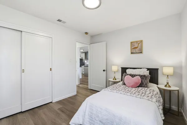 a bedroom with a bed and a closet