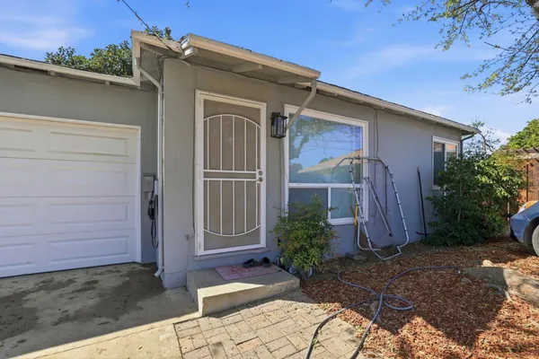 a view of front door and yard