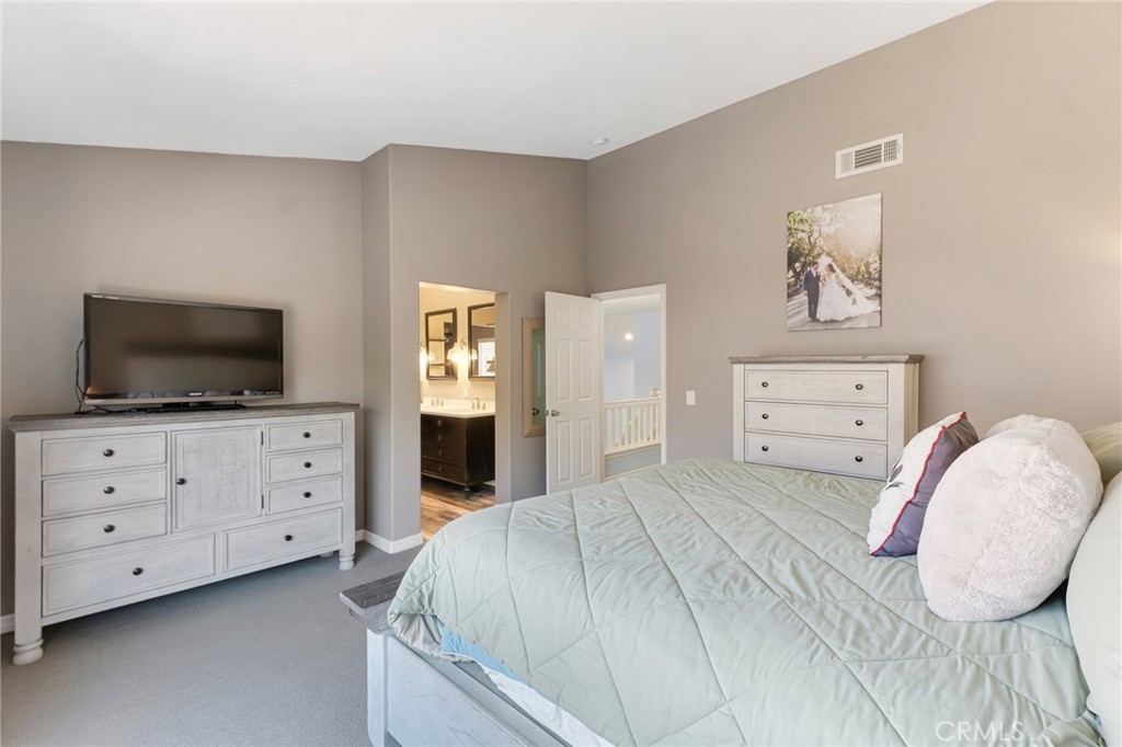 3843 San Gabriel Street Simi Valley, CA 93063 - Photo 33 of 52 a bedroom with a bed and a flat screen tv in the kitchen
