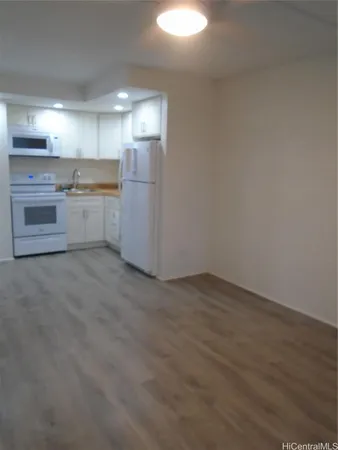 a view of a kitchen with a sink cabinets and a window