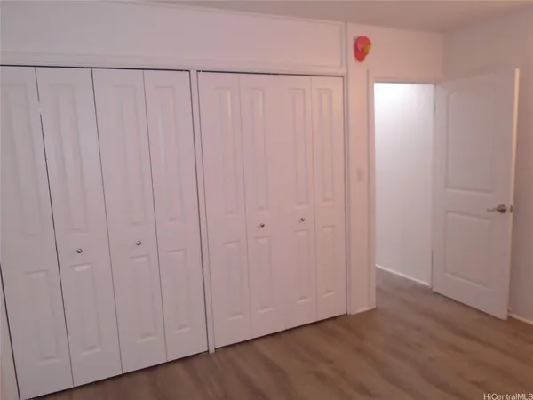 a view of a livingroom with wooden floor