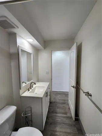 a bathroom with a sink and mirror