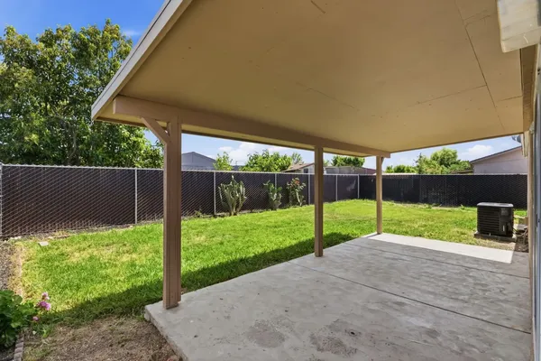 a view of backyard with small cabin