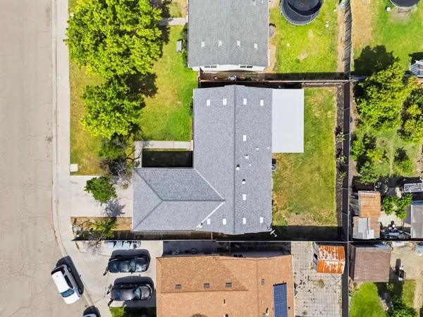 an aerial view of a house with swimming pool