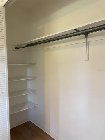 a view of an empty walk in closet